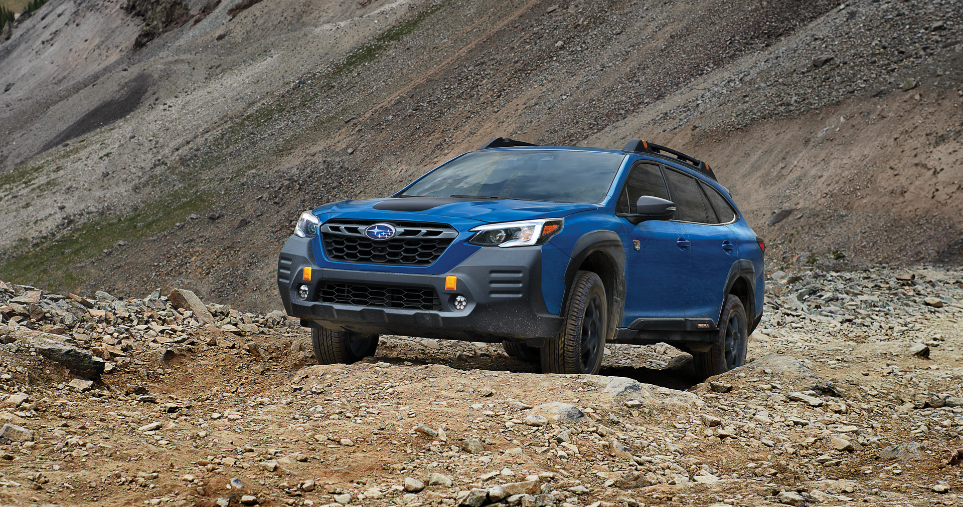 A 2023 Outback Wilderness driving on a trail in the mountains. | Zappone Subaru Norwich in Norwich NY