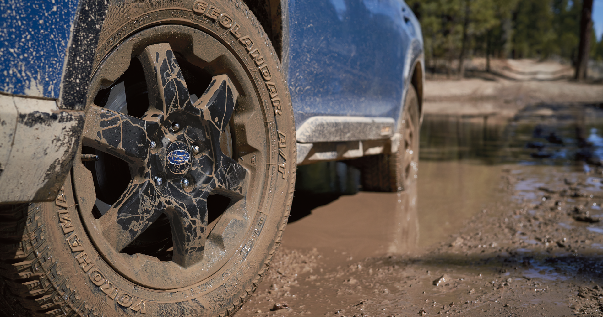 A close-up of the 17-inch off-road wheels and all-terrain Yokohama GEOLANDAR® tires on the 2023 Outback Wilderness. | Zappone Subaru Norwich in Norwich NY