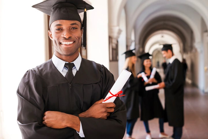 college graduate holding his diploma | Zappone Subaru Norwich in Norwich NY